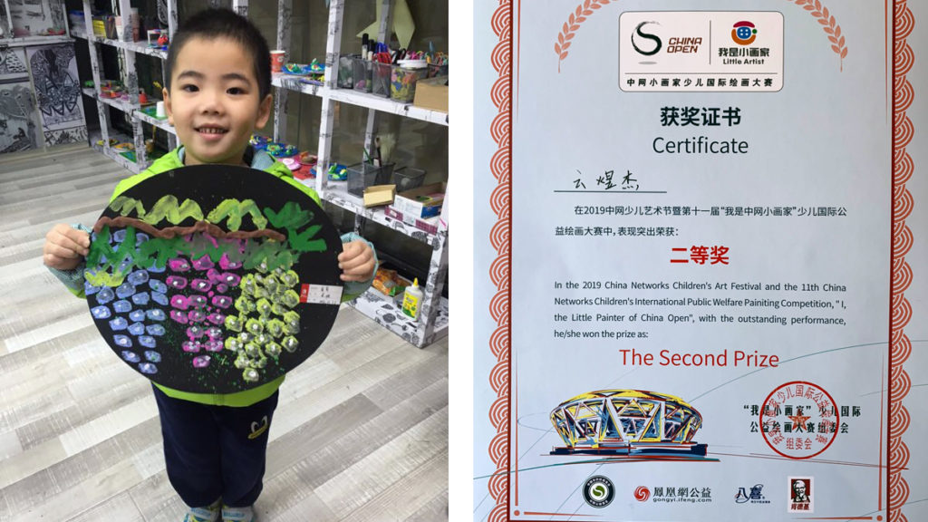 YUJIE YUN 11 YUJIE YUN WITH HIS DRAWING